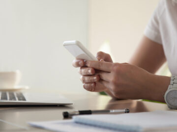 Businesswoman looking important contact on phone